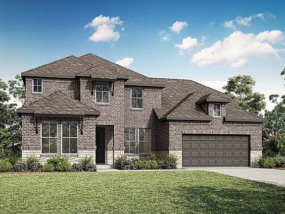 A two-story brick house with a garage, surrounded by a well-manicured lawn and lush greenery, stands