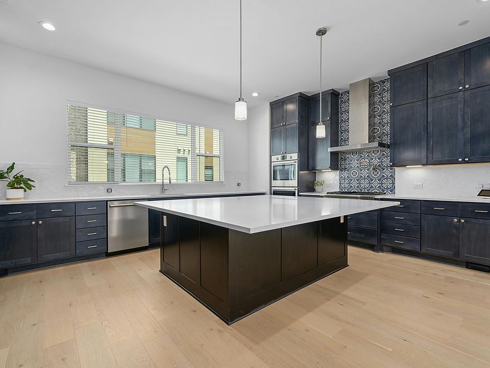 Gourmet kitchen, expansive island, double oven, full pantry, pot filler, built in microwave, abundant storage