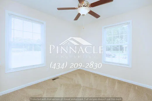 Second Bedroom Upstairs with Natural Light and Ceiling Fan