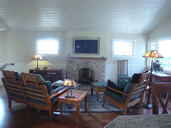 Custom Fireplace, built in flat screen, and vaulted ceilings.