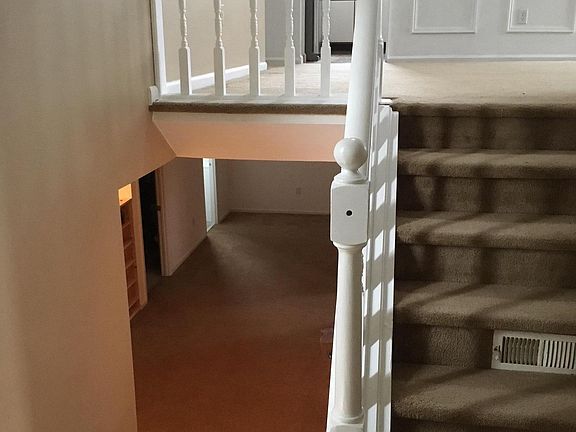 Up righthand stairs to LR/DR/Kitchen area, down lefthand sta