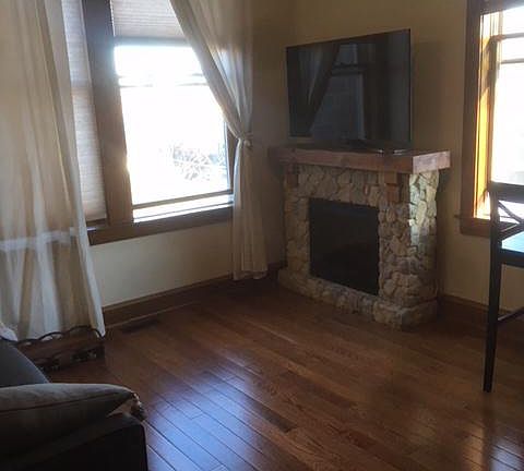 Living room features large energy-efficient windows