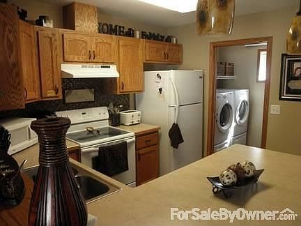 Kitchen
						:
						New back-splash, custom wood cabinets/countertops, laundry/half bath off kitchen