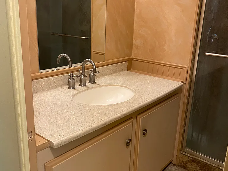 Guest bathroom with tile Shower.