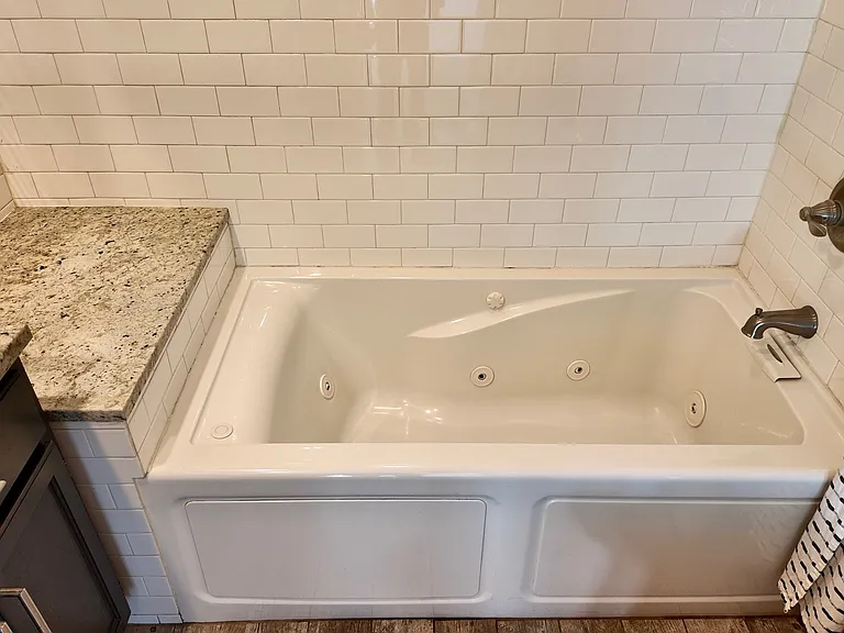 Jacuzzi tub in primary bathroom.