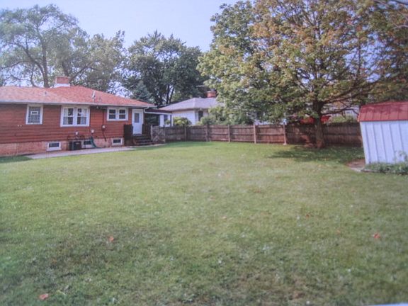 Huge fenced yard w/shed
