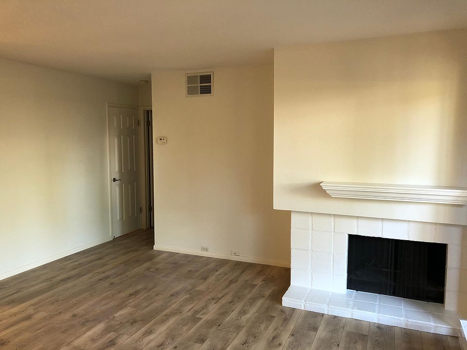 Living Room with new white paint and new laminate floors