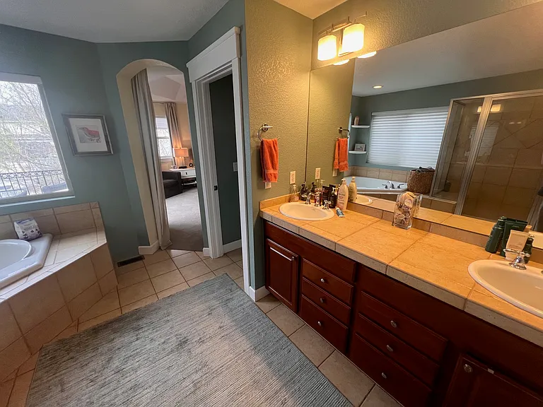 Main bath, seperate soaking tub, shower, master closet connects and has high efficiency washer/dryer