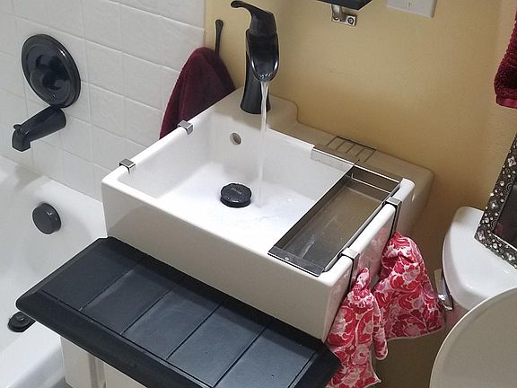 Waterfall faucet and fully appointed vessel sink