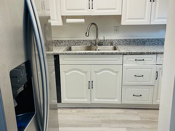 Kitchen with stainless steel appliances, granite countertop