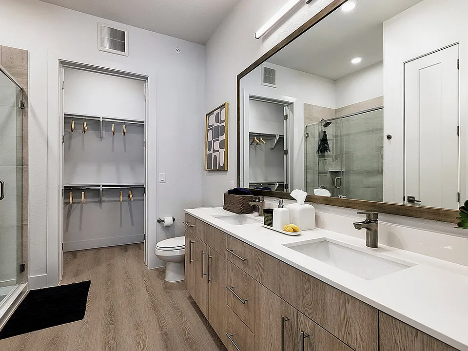 Contemporary design meets everyday function in this double vanity bathroom.