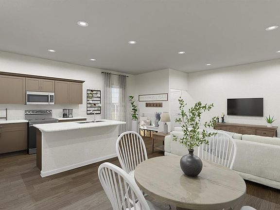 Enjoy your beautiful new kitchen with counter-height island and pantry. Artists rendering of the C