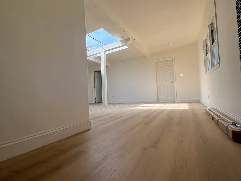 entrance into the house looking at living room and 2 bedrooms