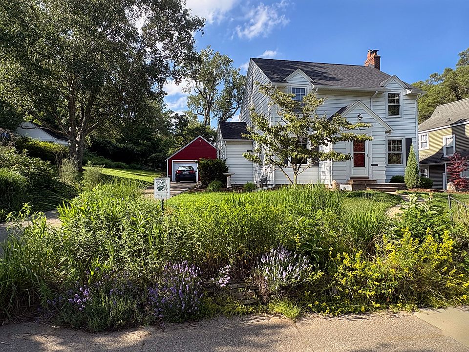 Welcome to this charming home nestled in the serene Hillcrest neighborhood, boasting a picturesque setting on a lush half-acre plot adorned with native trees and verdant grasses that offer stunning views throughout the year. Directly across from the home