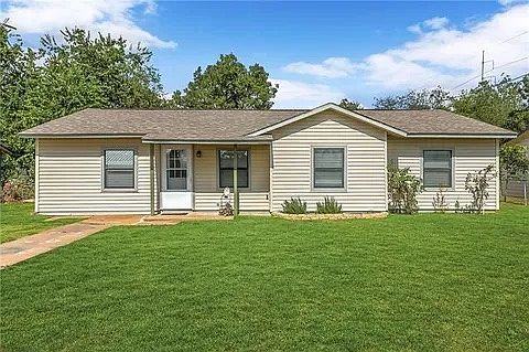 Charming single-story home with great curb appeal and a spacious front yard.