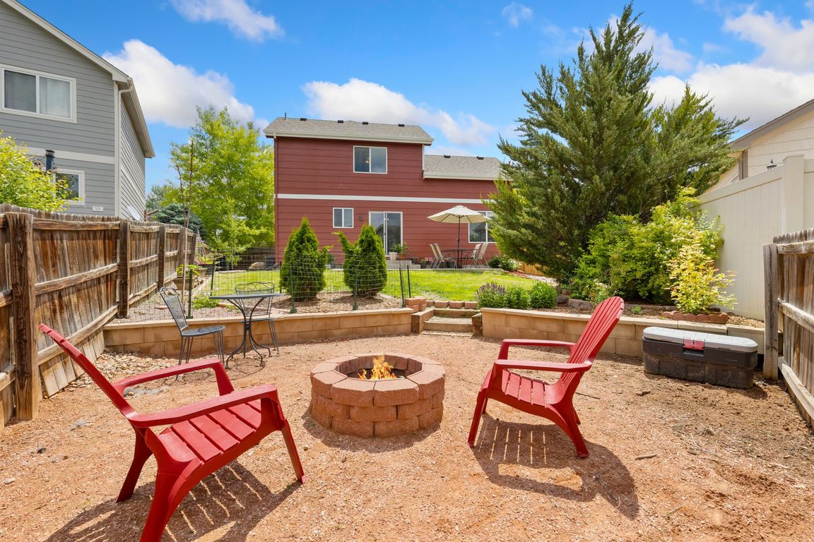 Enjoy summer nights by the fire pit in this awesome, expansive yard.
