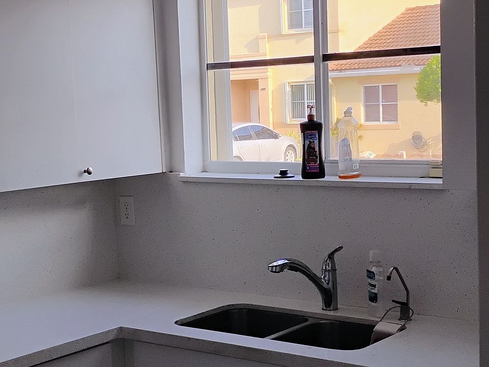 Kitchen with quartz counter top and backsplash.