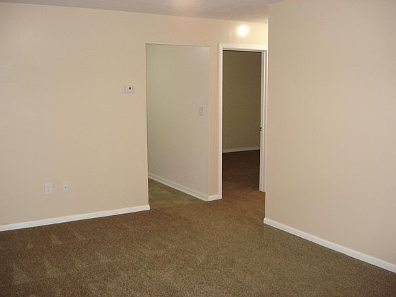 View of kitchen entry and hallway, original trim restored and painted a fresh white, throughout entire apartment, very nice