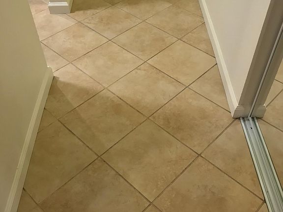 Tiled entry and kitchen.