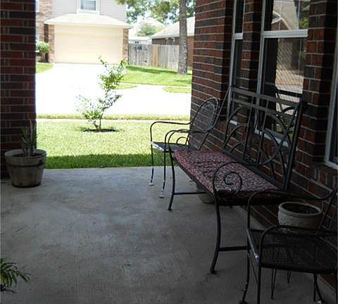 Nice covered porch.. relax at the end of the day