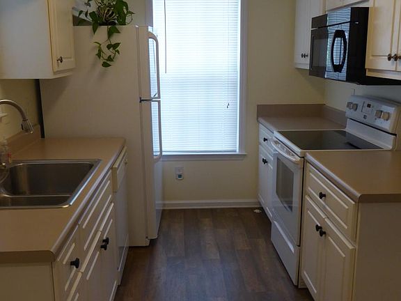 Kitchen with stove and microwave