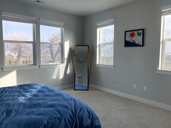 Primary bedroom - spacious, with enough room for a king-sized bed, nightstands, desk, and armoire