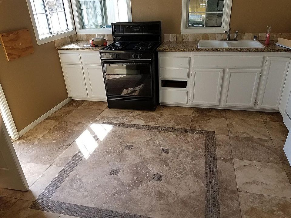 Kitchen with tile floors and granite countertops
