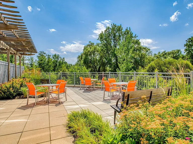 Plentiful outdoor seating in our beautifully landscaped deck