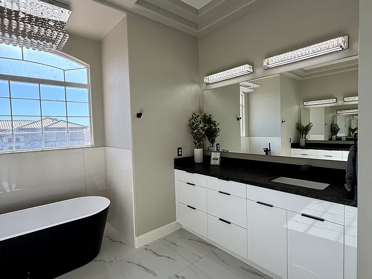 Right side: European-style vanity with sleek storage and granite countertops