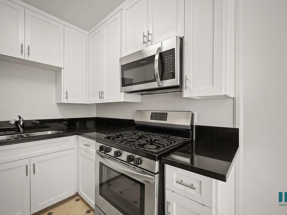Kitchen with Stainless-Steel Stove and Microwave Oven