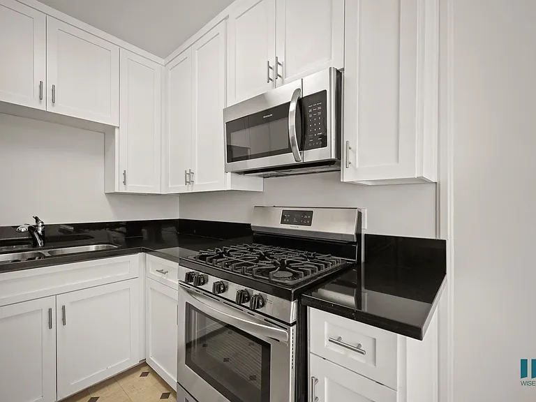Kitchen with Stainless-Steel Stove and Microwave Oven