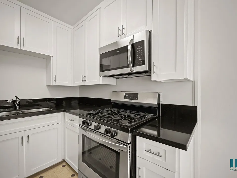 Kitchen with Stainless-Steel Stove and Microwave Oven