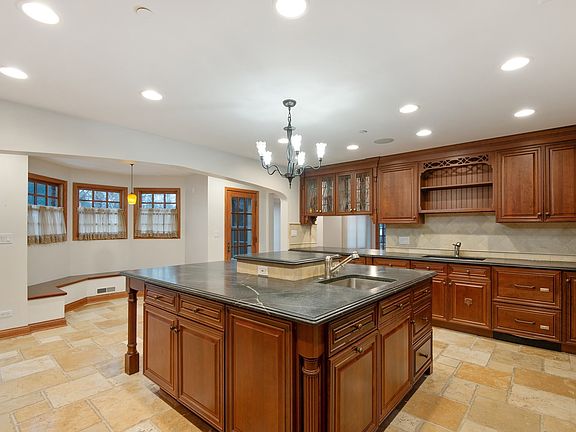 Custom kitchen with bay window eat-in area