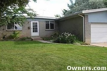 Oversized 2-car garage, beautiful trees and flowers.