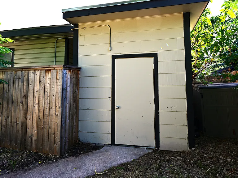 Storage building with washer and dryer.