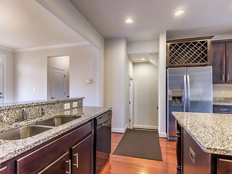 Stainless steel appliances, built-in wine rack, coffee/tea station and walk-in pantry on 2nd floor