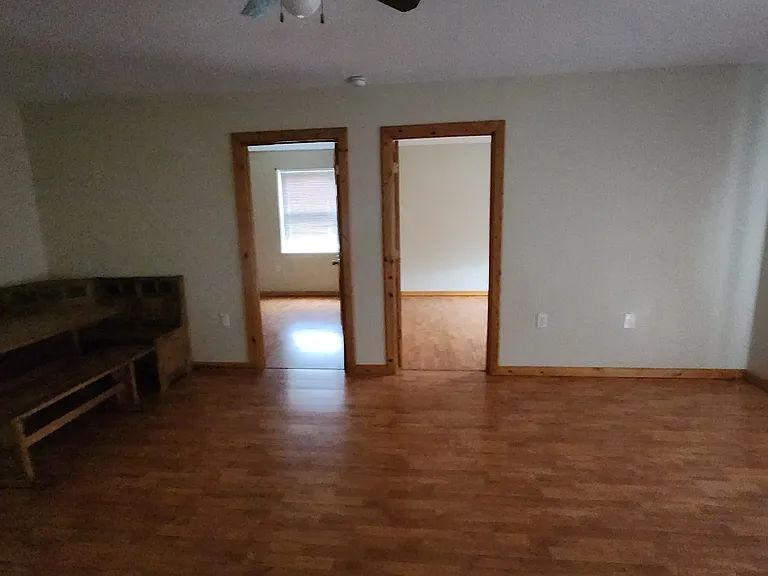 Living room /dining area showing bed room entrances