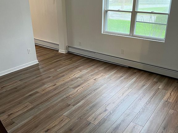 Could be used as dining room or family room. New flooring/drywall. Chandelier to be replaced with a new ceiling fan.