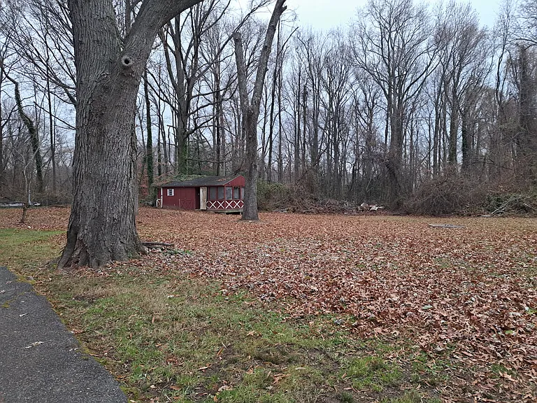 Large backyard and a storage building suitable for a workshop.