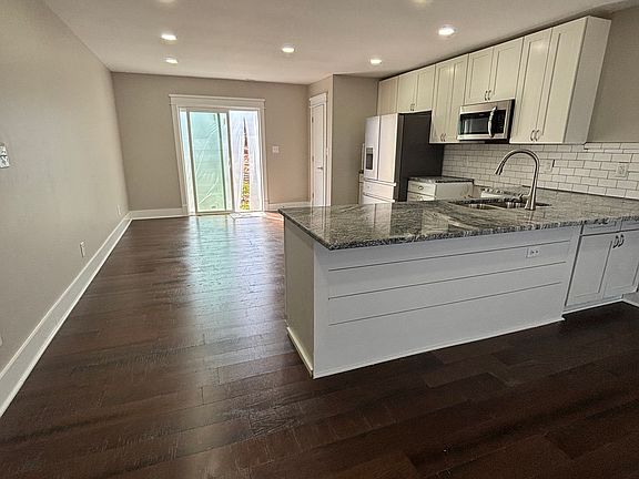 Large Open Living Room/Kitchen - with awesome view of the lake
