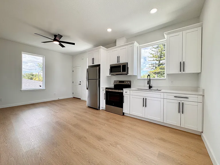 Open kitchen and living space with ample natural light.