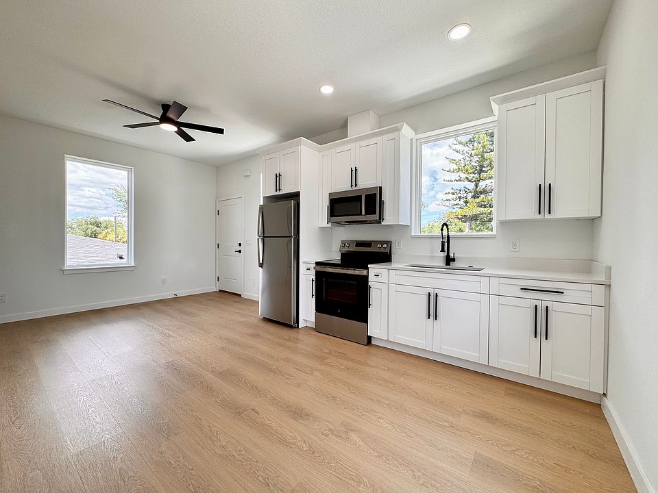 Open kitchen and living space with ample natural light.