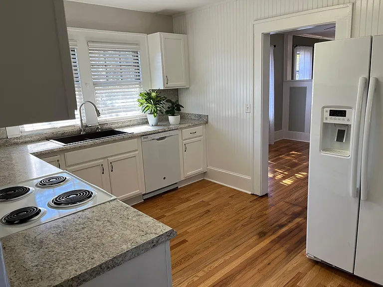 Entry to kitchen from the dining room. Yes, this house has a dishwasher.