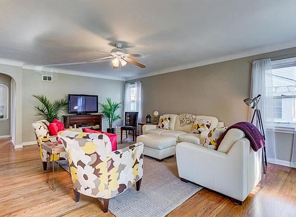 Large light and bright living room which is spacious enough to be used as a living room/dining room combo