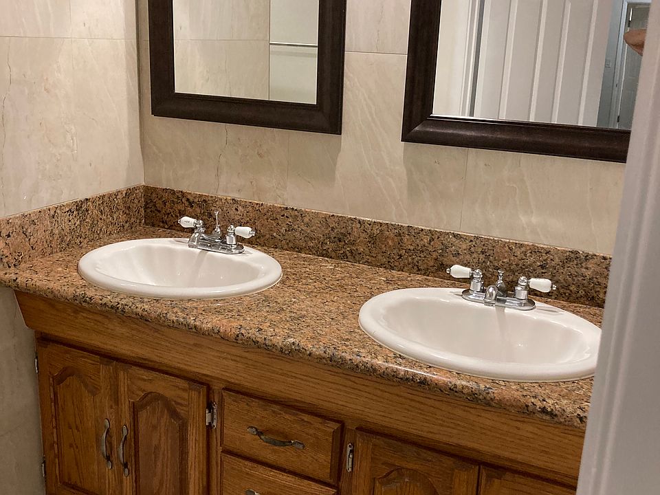 Master bathroom with double sink and mirrors. Medicine chest not shown but is to the right of mirrors.