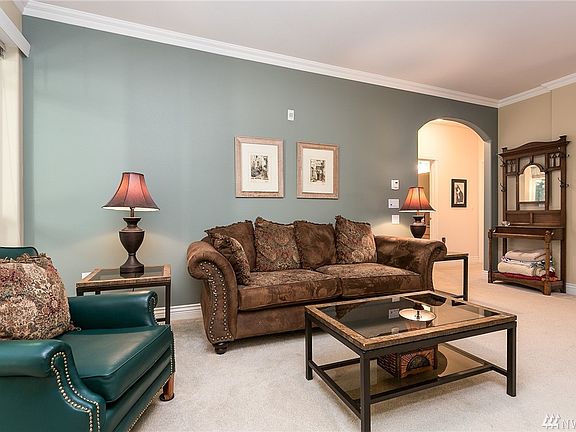 The arched door way into the hall from the living room is elegant and adds charm to this home.  