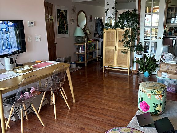 living/dining room looking to the kitchen/entryway