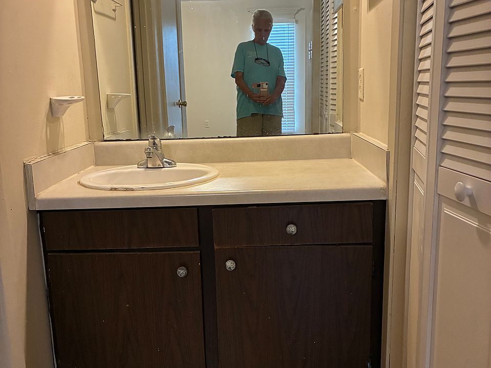 Vanity area is between bathroom and large closet.