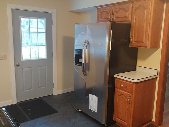 New entry door, frig & floor