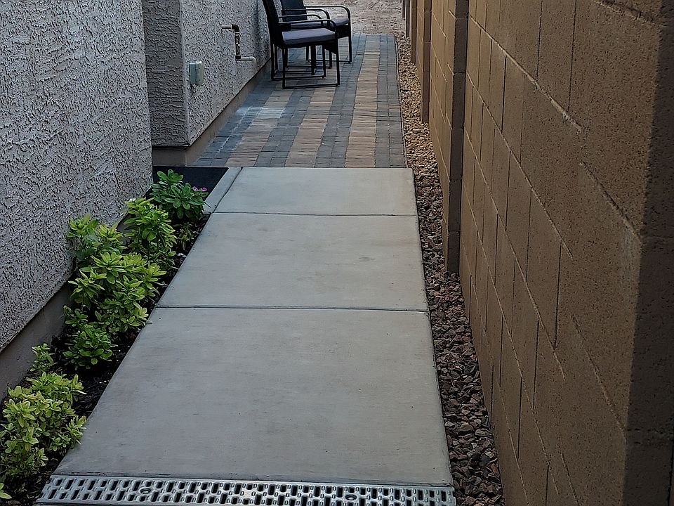 THE BLOCK WALL PROVIDES PRIVACY FROM NEIGHBORS. TWELVE FEET OF PAVERED WALKWAY PROVIDES ADDITIONAL OUTDOOR SPACE.